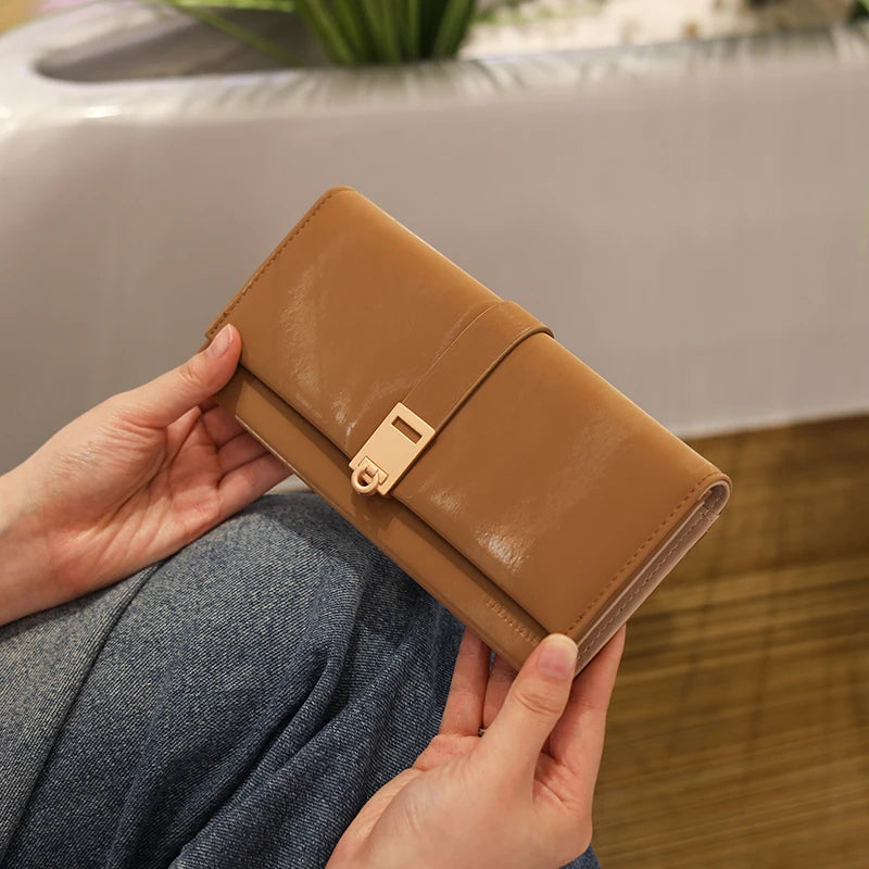 Autumn and winter new wallet women's long South Korea and South Korea small fresh PU leather solid color three fold bag simple s