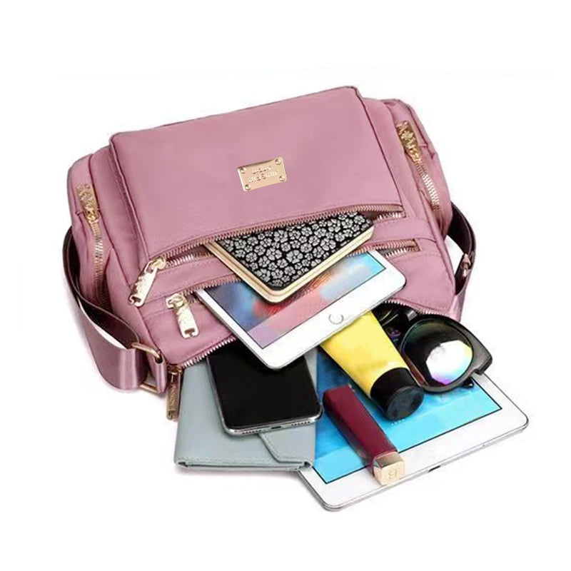 Women's handbag in various colors, multi-layered with zippers, can be worn diagonally or carried on the shoulder.