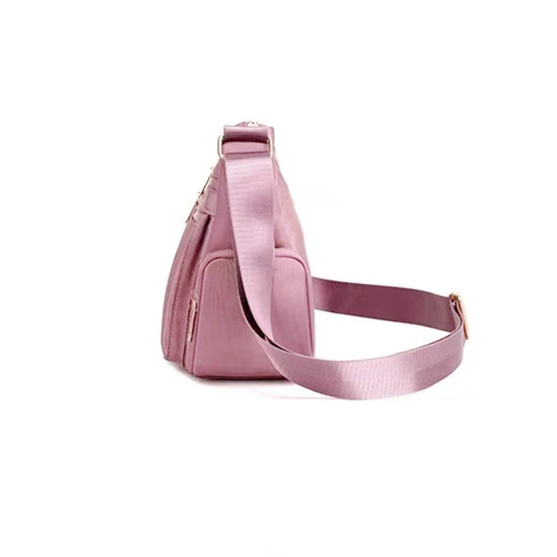 Women's handbag in various colors, multi-layered with zippers, can be worn diagonally or carried on the shoulder.