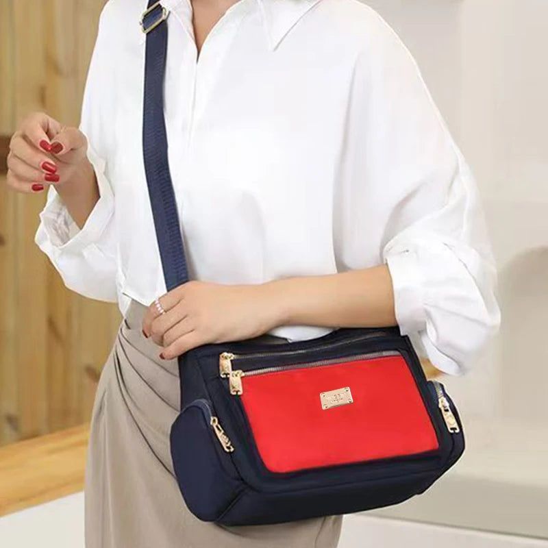 Women's handbag in various colors, multi-layered with zippers, can be worn diagonally or carried on the shoulder.